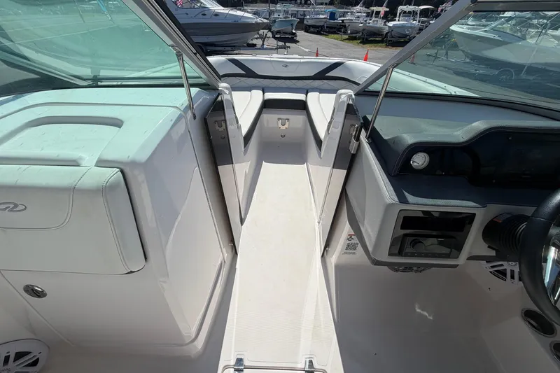 Slide: The Image of 2021 Regal 26 FasDeck boat interior with open cockpit and seating area. - 44