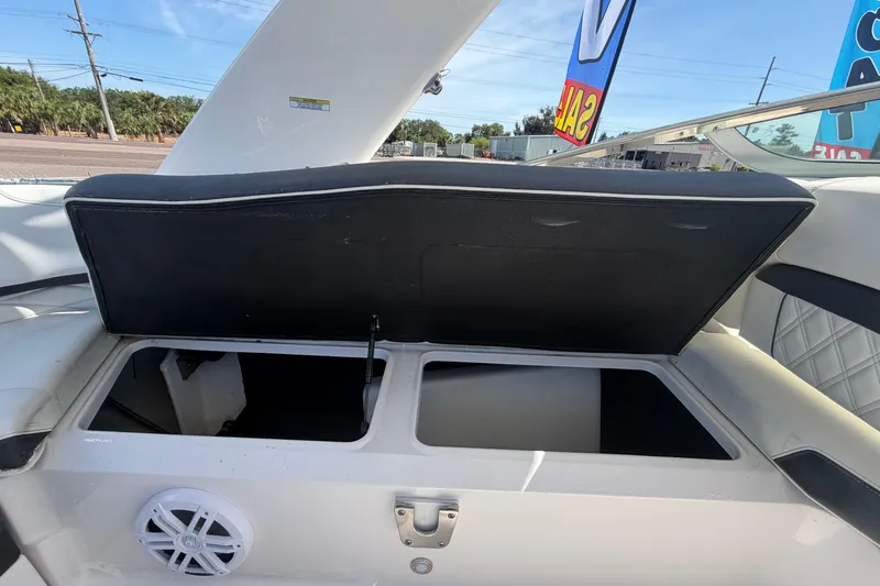 Slide: The Image of Open storage compartment on a 2021 Regal 26 FasDeck boat, showcasing interior space. - 71