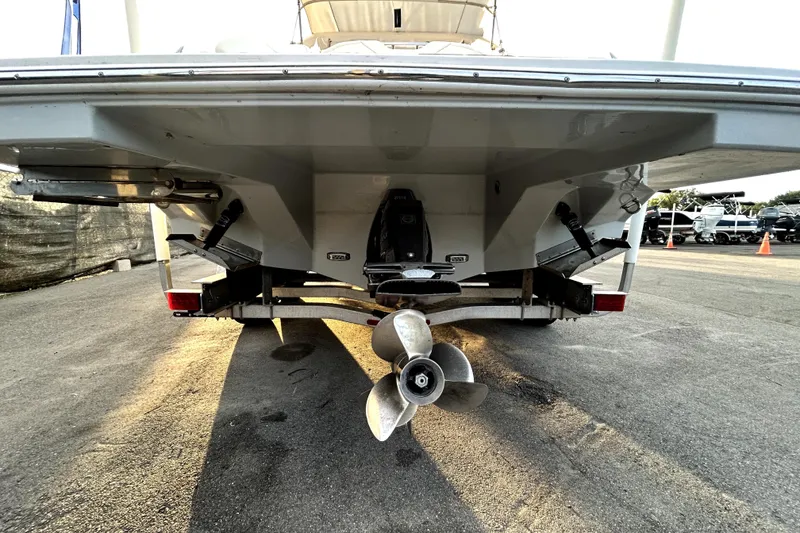 Slide: The Image of Rear view of a 2021 Regal 26 FasDeck boat on a trailer, showcasing the propeller. - 4