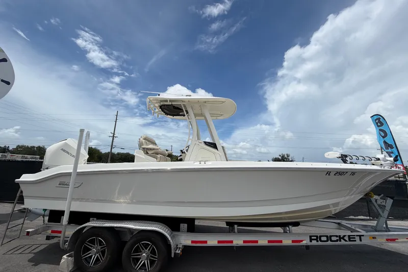 The Image of 2022 Boston Whaler 250 Dauntless boat on trailer under cloudy sky. - 0