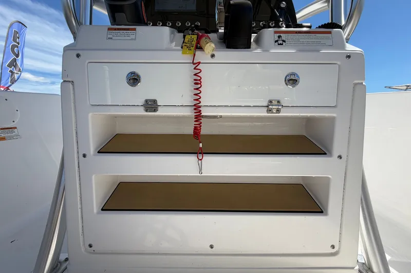 Slide: The Image of 2021 Sportsman Heritage 211 Center Console dashboard with storage compartments. - 29