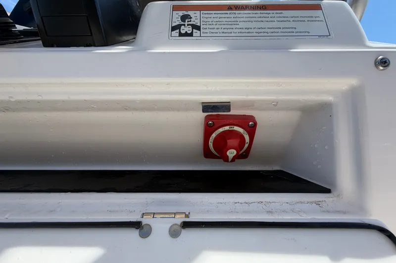Slide: The Image of 2021 Sportsman Heritage 211 Center Console boat with safety warning and control switch. - 31