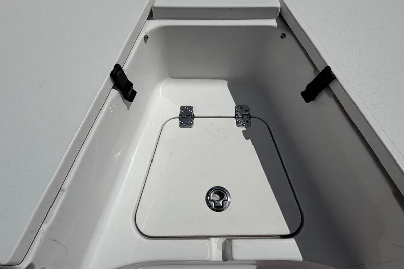 Slide: The Image of An open storage compartment on a 2021 Sportsman Heritage 211 Center Console boat. - 44
