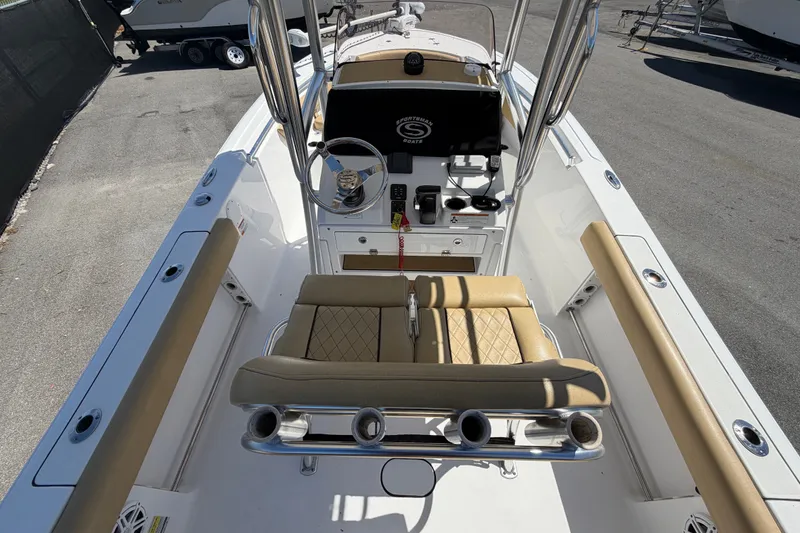 Slide: The Image of 2021 Sportsman Heritage 211 Center Console boat interior with tan seating and steering console. - 15