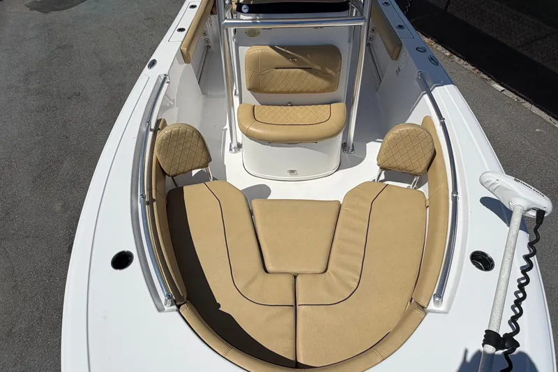 Slide: The Image of 2021 Sportsman Heritage 211 Center Console boat with tan cushioned seating. - 55