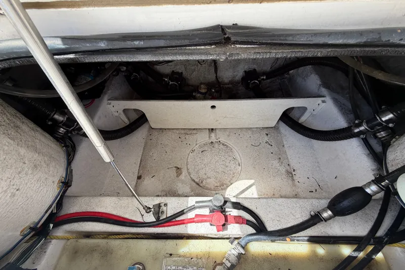 Slide: The Image of 2021 Sportsman Heritage 211 Center Console boat interior, showing wiring and mechanical components. - 70