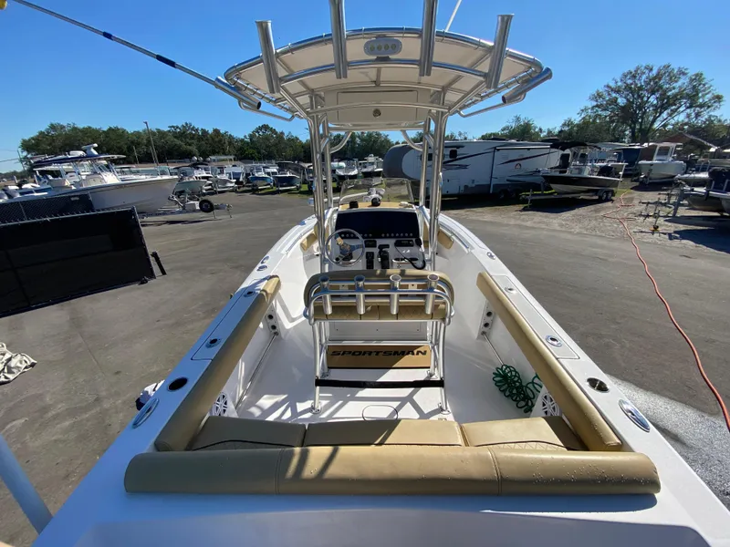 Slide: The Image of 2021 Sportsman Heritage 211 Center Console boat in a marina setting. - 9