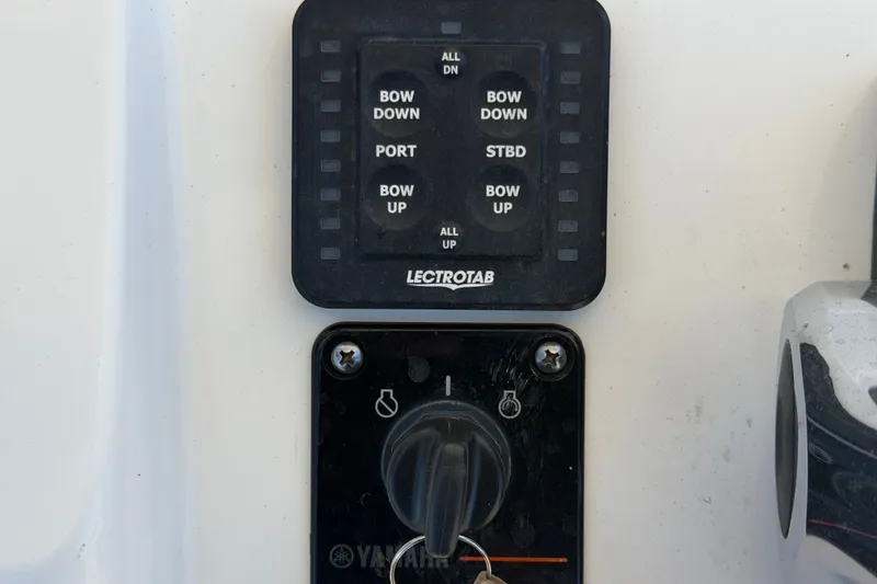 Slide: The Image of Control panel of a 2021 Sportsman Heritage 211 Center Console boat. - 25
