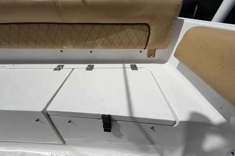 Slide: The Image of 2021 Sportsman Heritage 211 Center Console boat seating and storage compartments. - 72