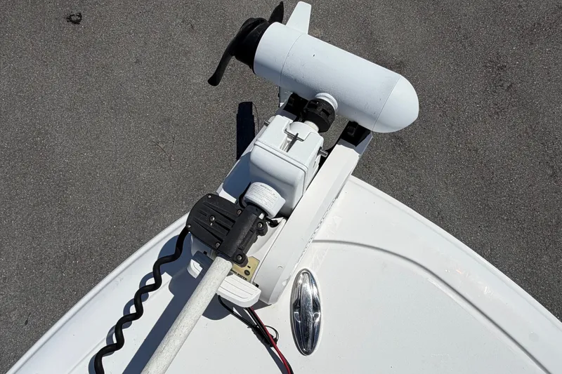 Slide: The Image of 2021 Sportsman Heritage 211 Center Console boat with trolling motor on deck. - 52