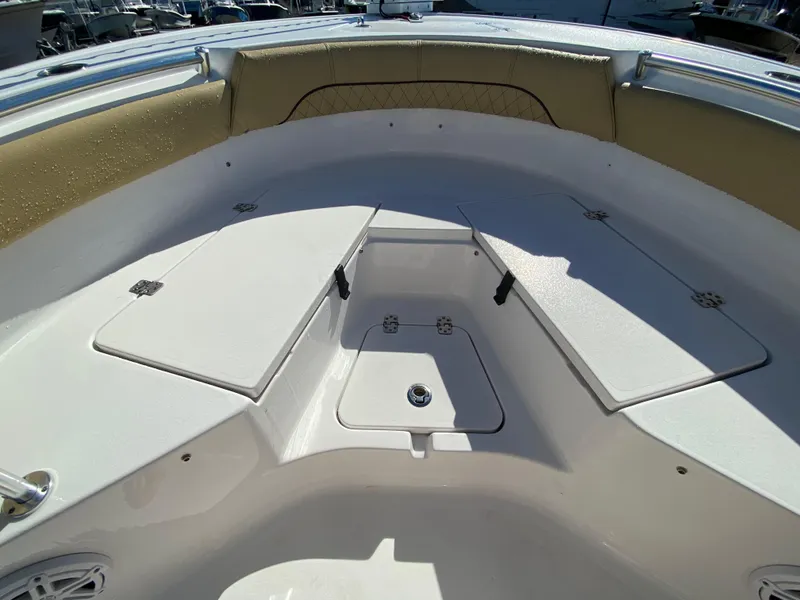 Slide: The Image of 2021 Sportsman Heritage 211 Center Console boat interior with storage compartments. - 24