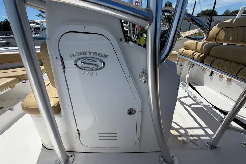 Slide: The Image of 2021 Sportsman Heritage 211 Center Console boat interior with seating and console details. - 33