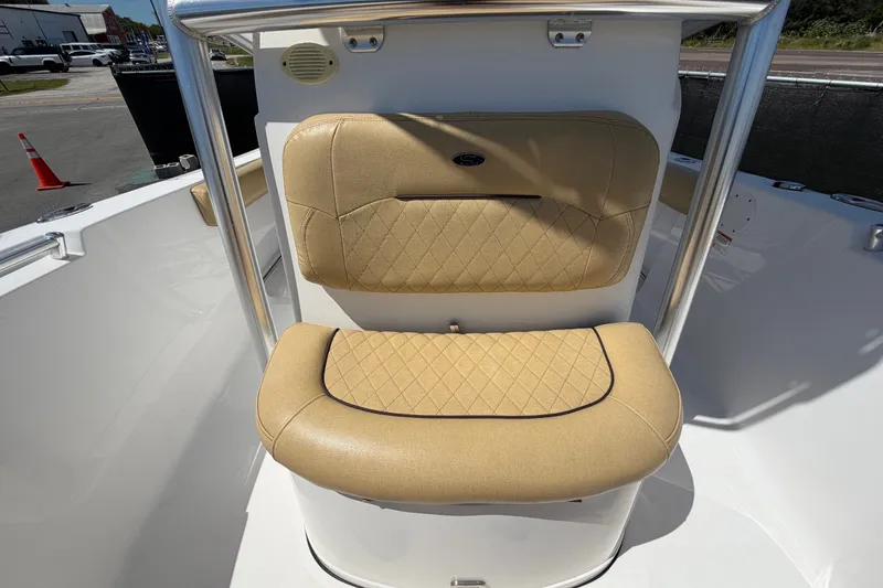 Slide: The Image of 2021 Sportsman Heritage 211 Center Console boat seating with tan upholstery. - 57