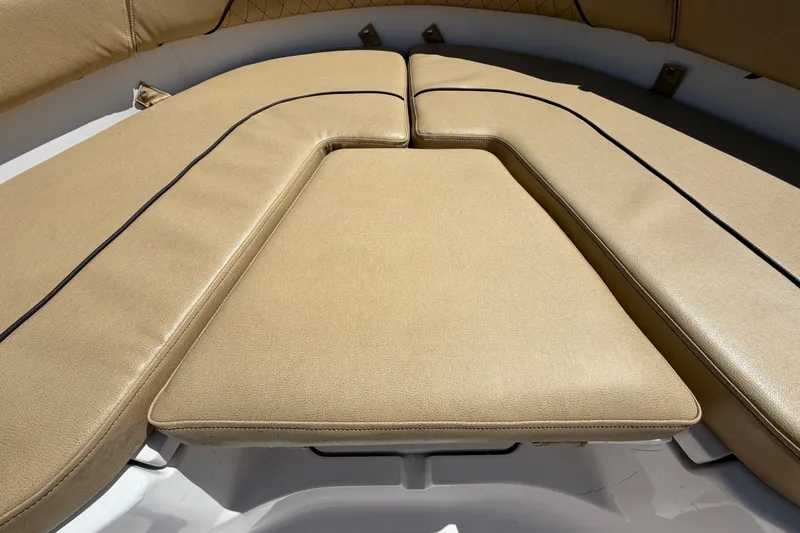 Slide: The Image of 2021 Sportsman Heritage 211 Center Console boat with tan cushioned seating. - 43
