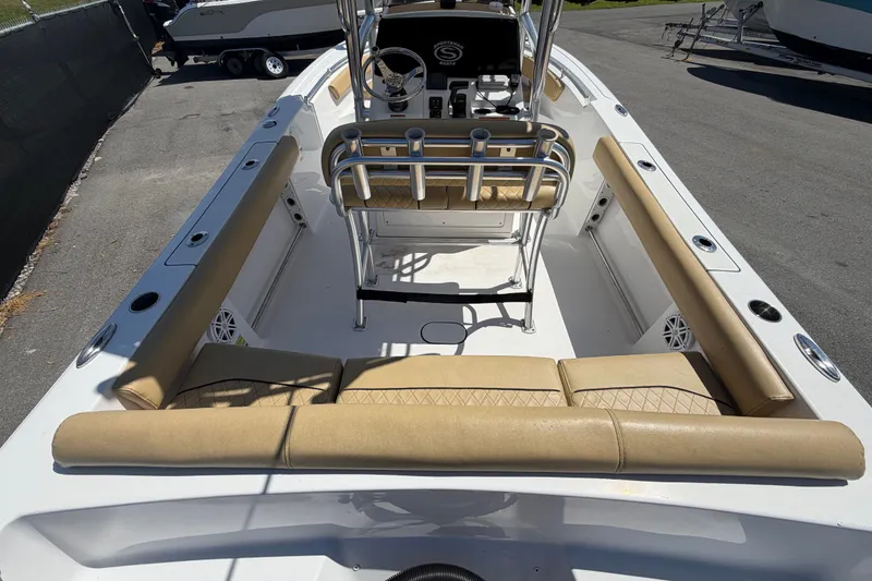 Slide: The Image of 2021 Sportsman Heritage 211 Center Console boat with tan seating and steering console. - 13