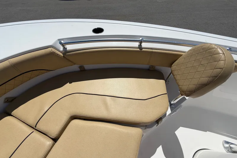 Slide: The Image of 2021 Sportsman Heritage 211 Center Console boat with tan cushioned seating. - 46
