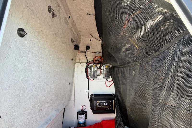 Slide: The Image of Interior view of a 2021 Sportsman Heritage 211 Center Console boat wiring setup. - 35