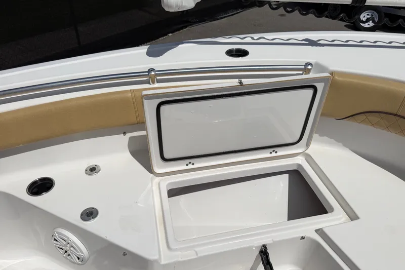 Slide: The Image of 2021 Sportsman Heritage 211 Center Console boat with open storage compartment. - 42