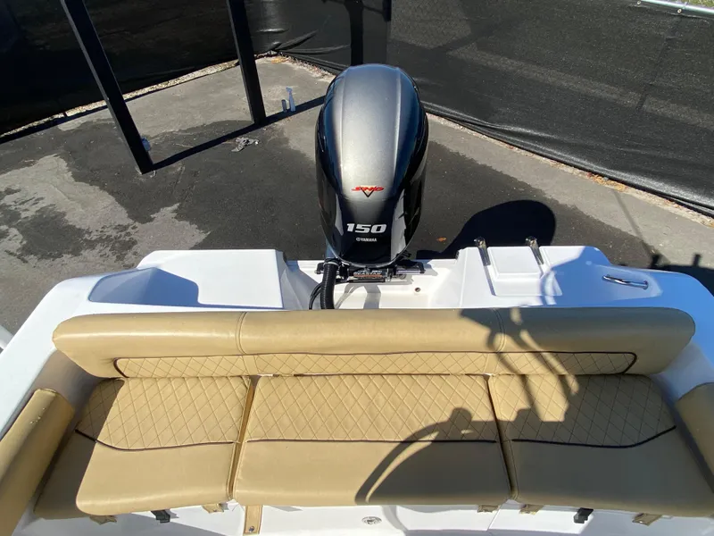 Slide: The Image of 2021 Sportsman Heritage 211 Center Console with Yamaha 150 engine and tan seating. - 37