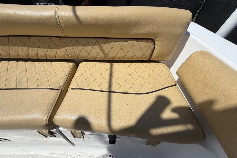 Slide: The Image of Tan cushioned seating on 2021 Sportsman Heritage 211 Center Console boat. - 71