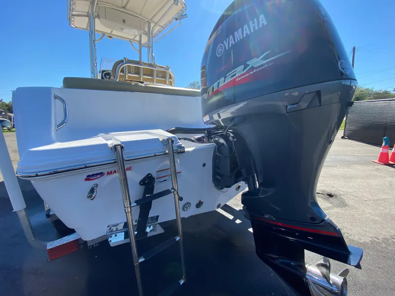 Slide: The Image of 2021 Sportsman Heritage 211 Center Console with Yamaha outboard motor and swim ladder. - 5
