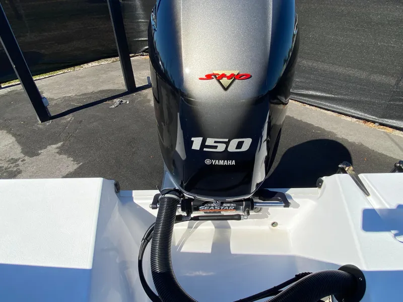 Slide: The Image of Yamaha 150 outboard motor on 2021 Sportsman Heritage 211 Center Console boat. - 38