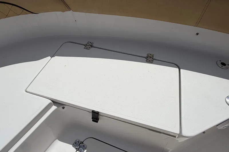 Slide: The Image of 2021 Sportsman Heritage 211 Center Console boat interior storage compartment. - 47