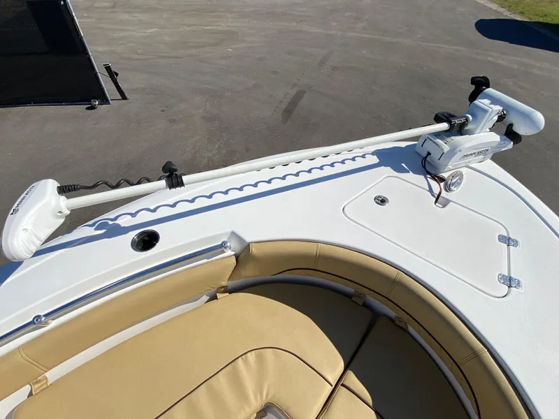 Slide: The Image of 2021 Sportsman Heritage 211 Center Console boat with trolling motor and tan seating. - 22