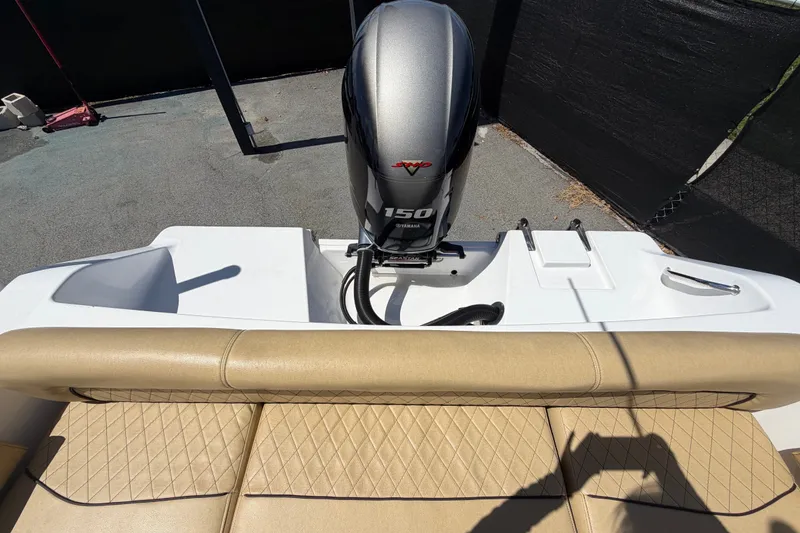 Slide: The Image of 2021 Sportsman Heritage 211 Center Console boat with Yamaha 150 engine, rear seating view. - 74