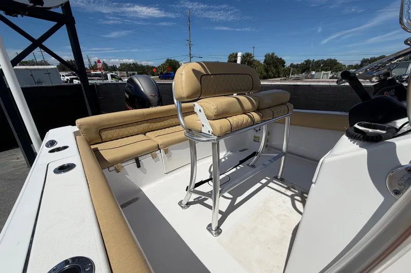 Slide: The Image of 2021 Sportsman Heritage 211 Center Console boat interior with tan seating and console. - 61