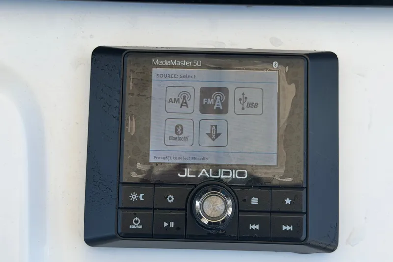Slide: The Image of JL Audio MediaMaster 50 control panel on 2021 Sportsman Heritage 211 Center Console boat. - 24