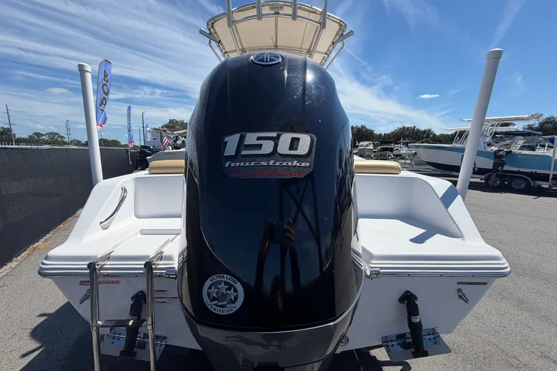 Slide: The Image of 2021 Sportsman Heritage 211 Center Console with 150 horsepower outboard motor. - 3