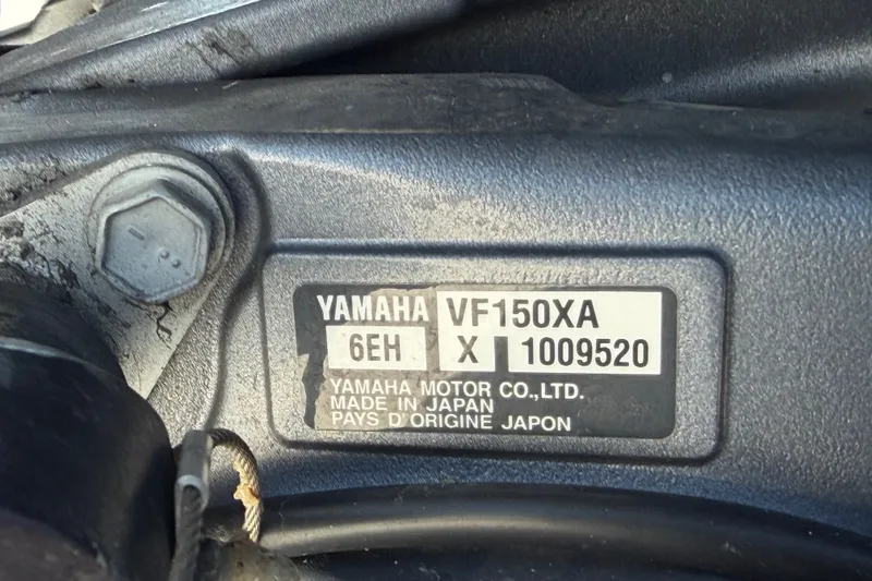 Slide: The Image of Yamaha VF150XA engine label on 2021 Sportsman Heritage 211 Center Console boat. - 77