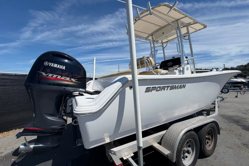 Slide: The Image of 2021 Sportsman Heritage 211 Center Console boat with Yamaha VMAX engine on trailer. - 2