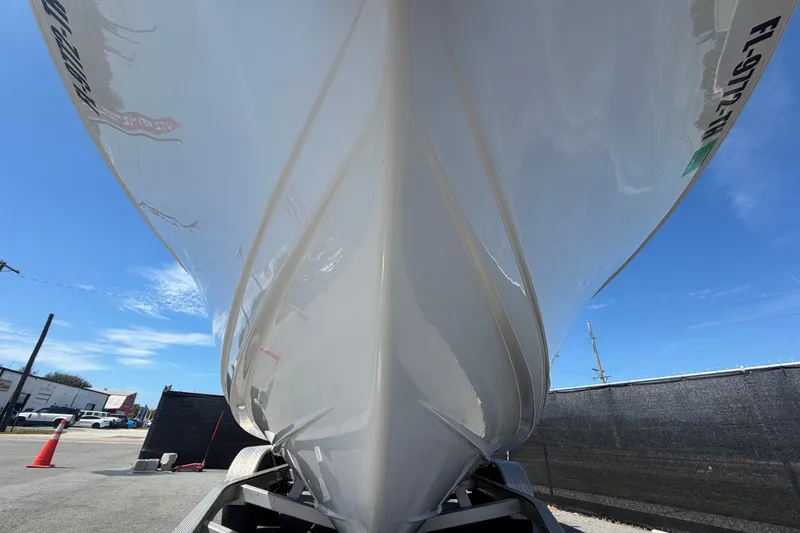 Slide: The Image of 2021 Sportsman Heritage 211 Center Console boat on trailer, viewed from below. - 11