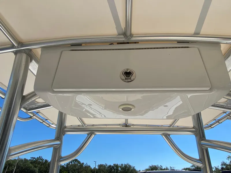 Slide: The Image of 2021 Sportsman Heritage 211 Center Console T-top storage compartment. - 12