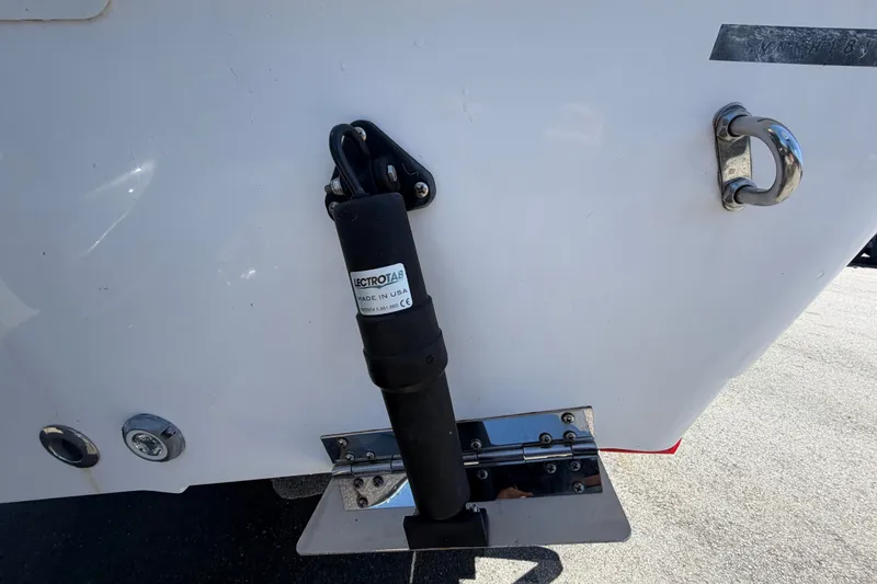 Slide: The Image of 2021 Sportsman Heritage 211 Center Console boat with Lectrotab trim tab actuator. - 5