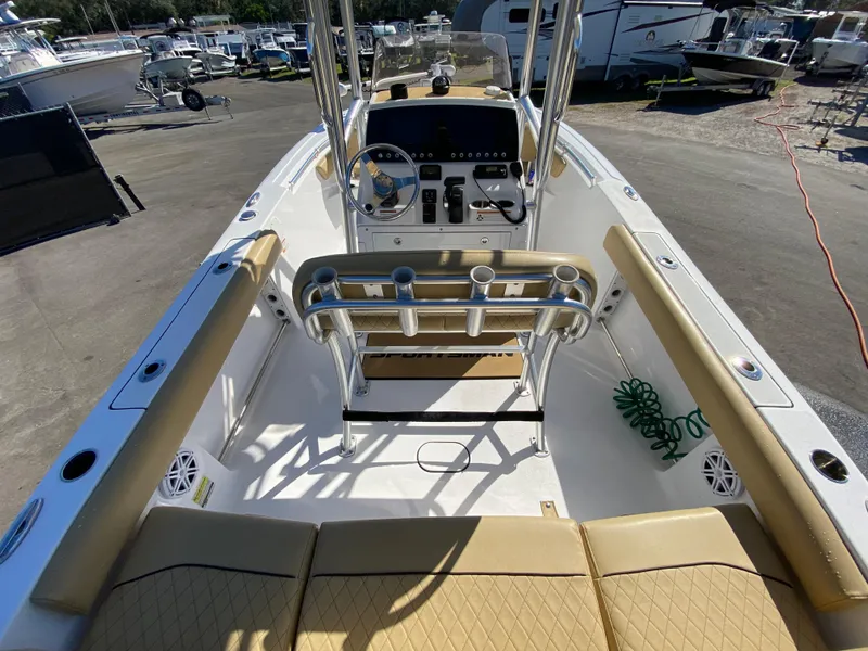 Slide: The Image of 2021 Sportsman Heritage 211 Center Console boat interior with seating and steering wheel. - 10