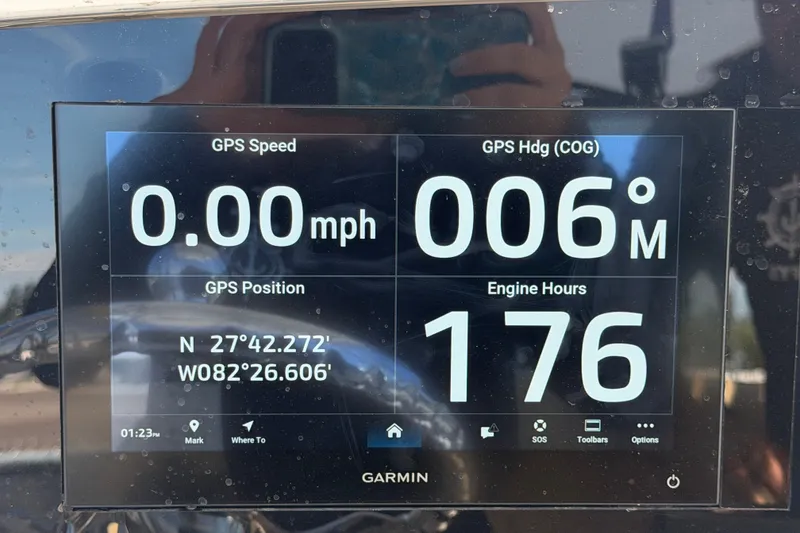 Slide: The Image of Garmin GPS display on 2021 Sportsman Heritage 211 Center Console showing speed, heading, and engine hours. - 22