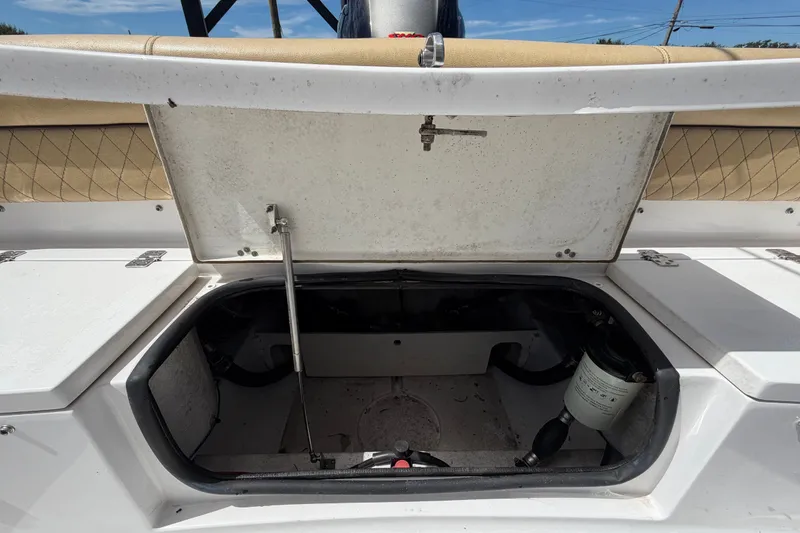 Slide: The Image of Open storage compartment on a 2021 Sportsman Heritage 211 Center Console boat. - 69