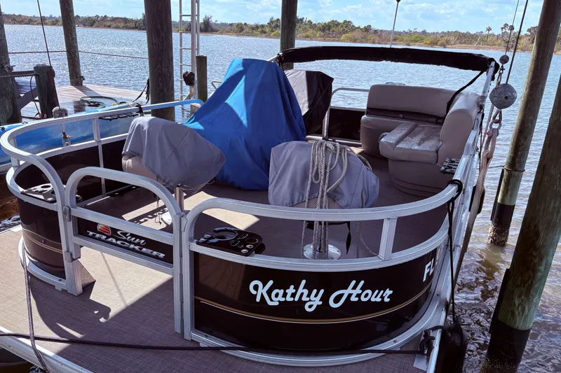 The Image of 2021 Sun Tracker Bass Buggy 16 XL pontoon boat docked by the water. - 0