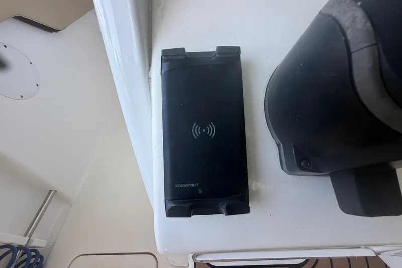 Slide: The Image of Wireless charging pad on 2021 Tidewater 272 CC Adventure boat deck. - 19