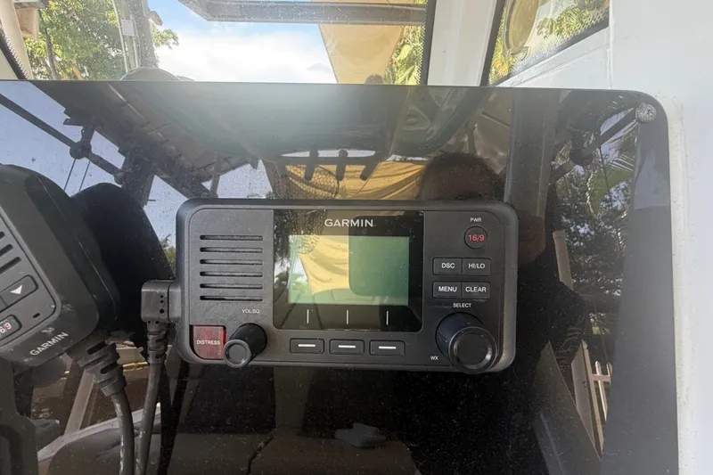 Slide: The Image of Garmin marine radio on 2021 Tidewater 272 CC Adventure boat dashboard. - 20