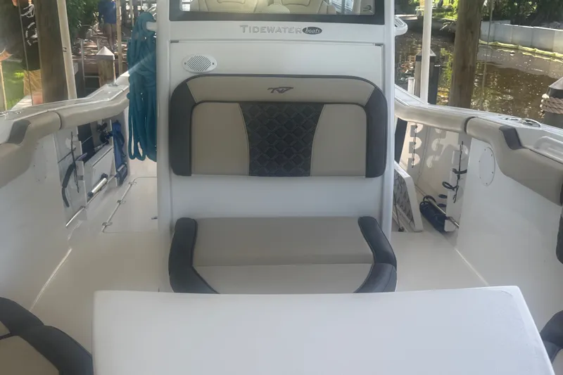 Slide: The Image of 2021 Tidewater 272 CC Adventure boat interior with seating and storage. - 23
