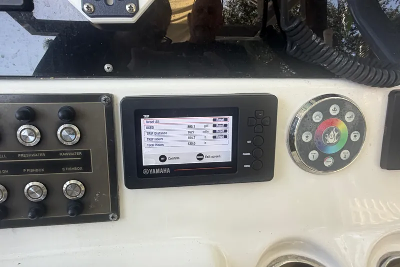 Slide: The Image of Control panel of a 2021 Tidewater 272 CC Adventure boat with Yamaha display. - 17