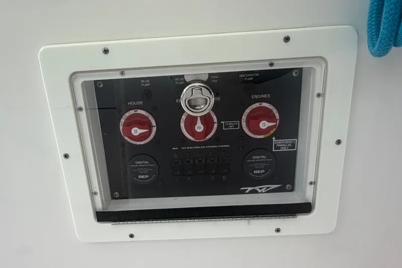 Slide: The Image of Control panel of a 2021 Tidewater 272 CC Adventure boat, featuring switches and gauges. - 44