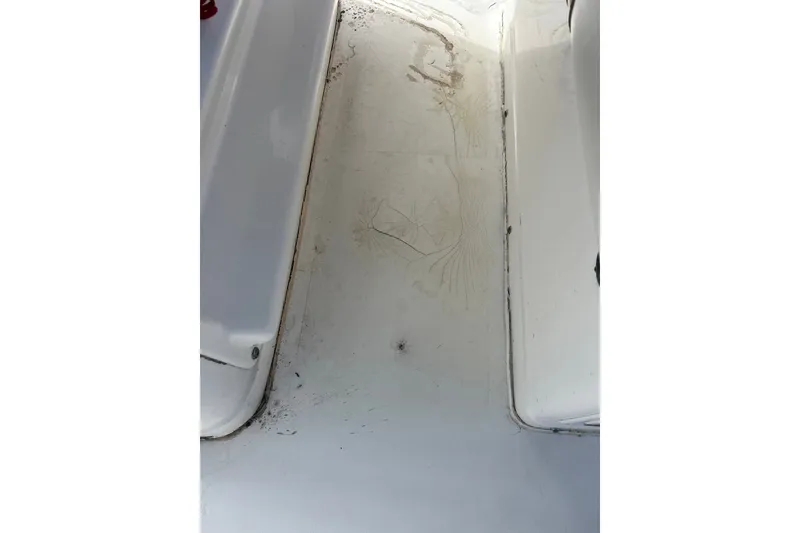 Slide: The Image of Dirty deck of a 2021 Tidewater 272 CC Adventure boat, showing wear and grime. - 35