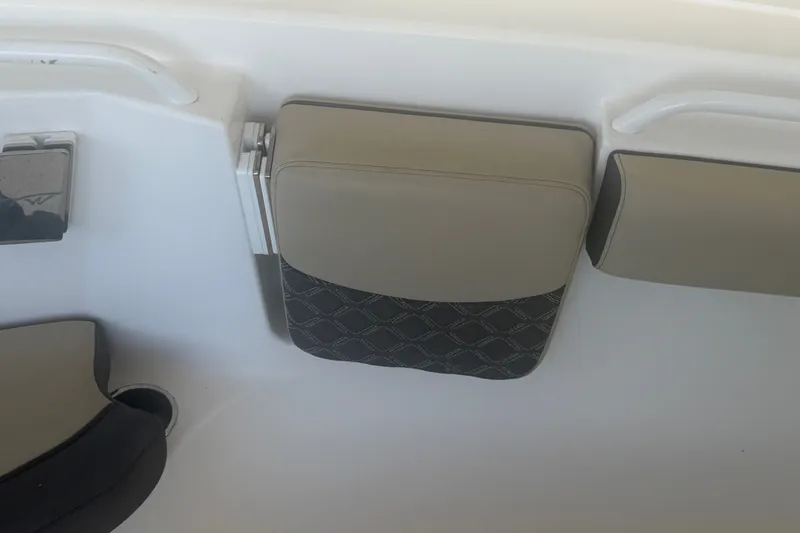 Slide: The Image of 2021 Tidewater 272 CC Adventure boat interior with cushioned seating detail. - 26