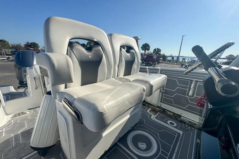 Slide: The Image of 2021 Wellcraft 262 Fisherman boat interior with dual seats and steering wheel. - 50