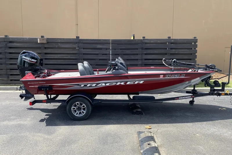 The Image of 2022 Tracker Pro Team 175 TXW Tournament Edition boat on trailer, side view. - 0